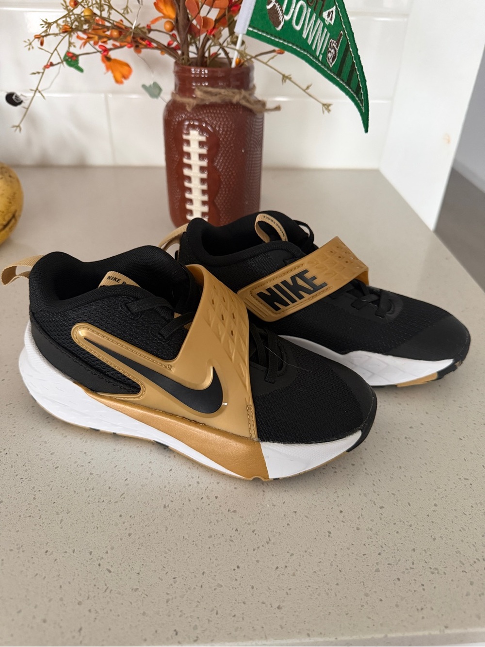 Nike Kids Black and Gold Strap Sneakers